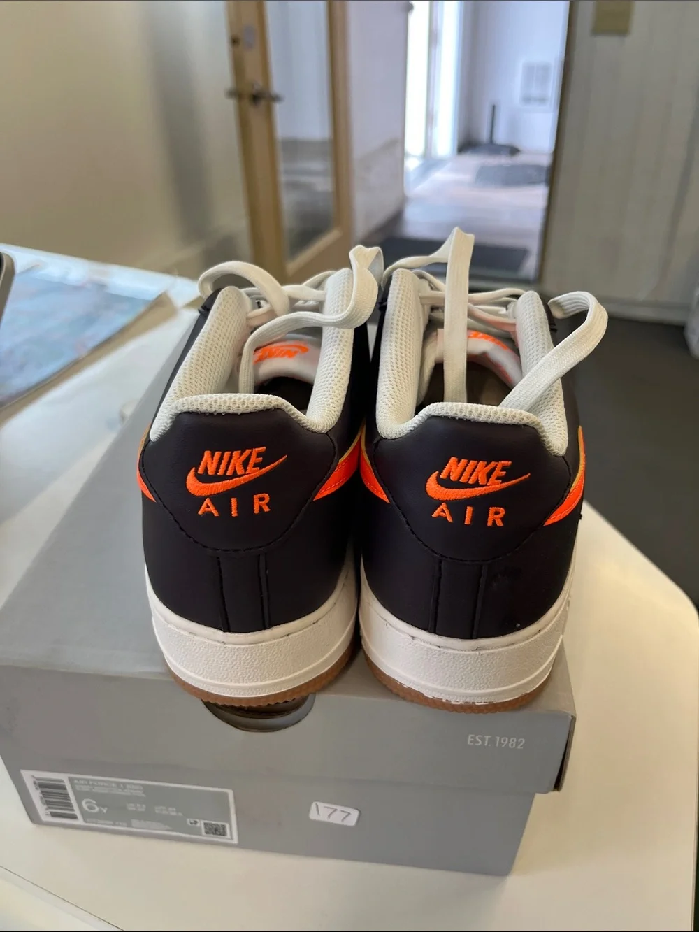 Nike Air Force 1’s Men’s Low-Top Sneakers - Black/White with Orange Swoosh